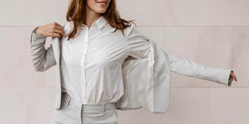 front view smiley elegant businesswoman putting suit