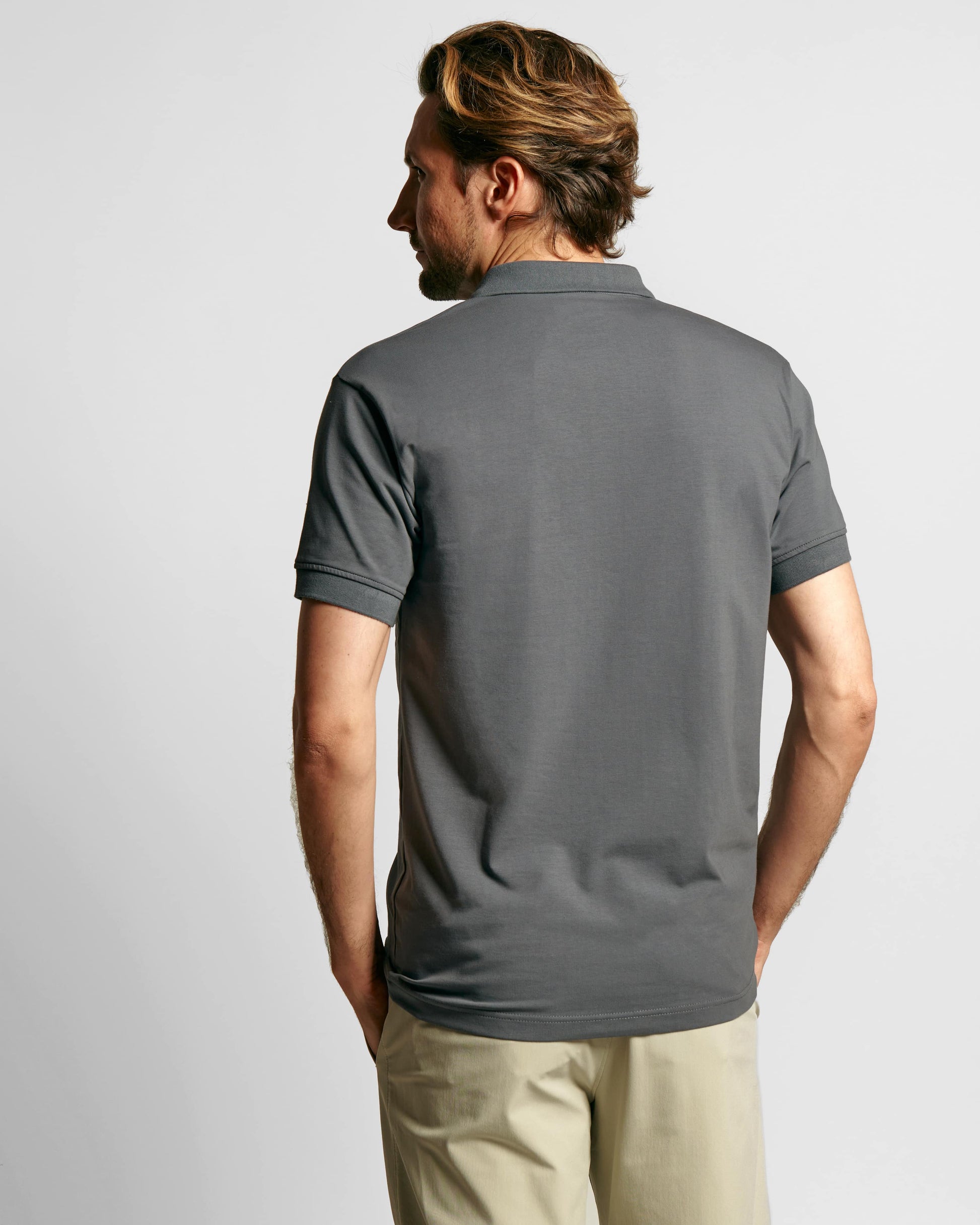 Model wearing Neat Sweat Proof Short Sleeve Polo PDP Grey