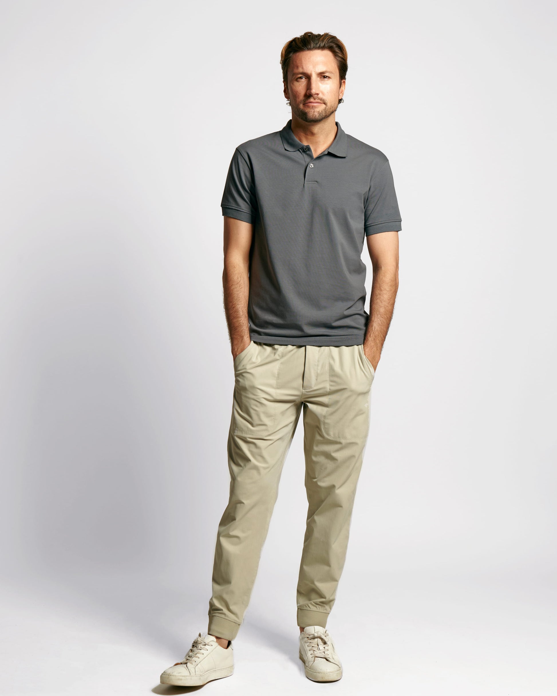 Model wearing Neat Sweat Proof Short Sleeve Polo PDP Grey