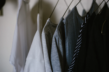 Shirts hanging on a clothing rack to illustrate breathable fabrics