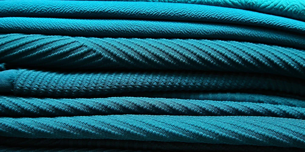 Various turquoise colored designer fabrics