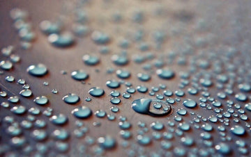 Close-up of fabric covered with water droplets