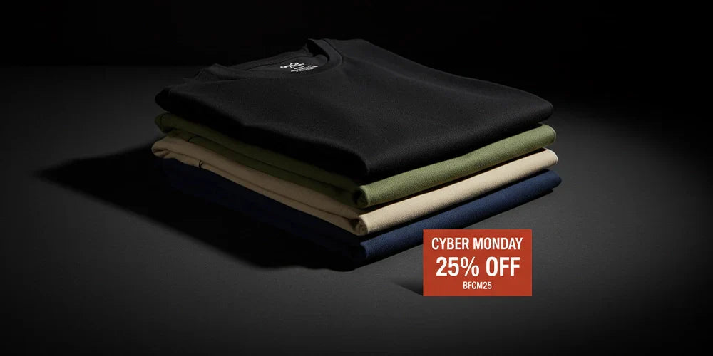 Flat-lay of moisture-wicking undershirts with Cyber Monday 25% off discount tag.