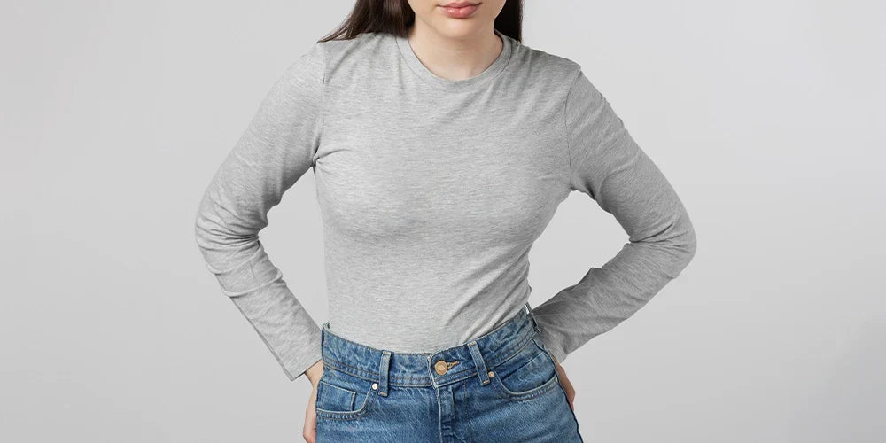 Girl wearing Long sleeve grey undershirt posing in studio