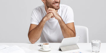 men at work smiling and wearing comfortable cooling undershirt
