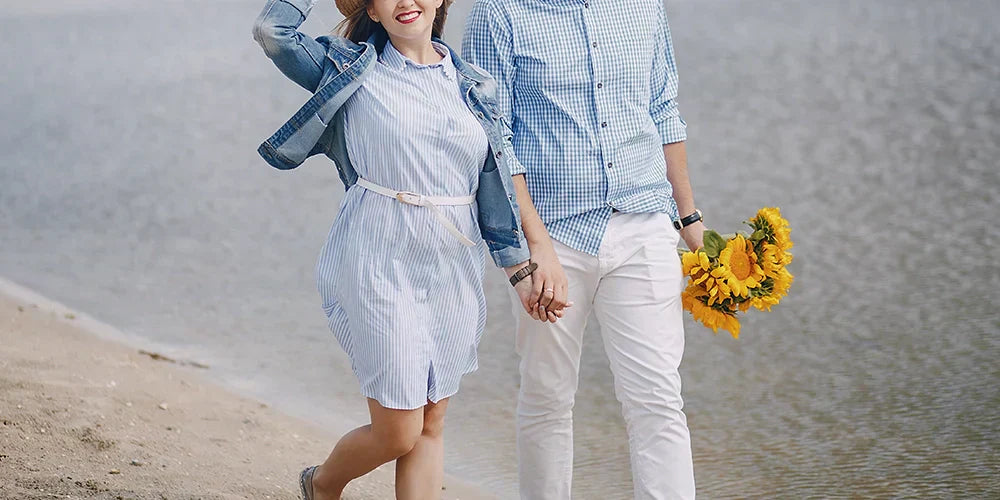  Couple near water holding hands and sunflower