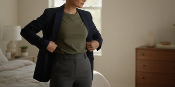 Professional woman getting dressed for a long workday.