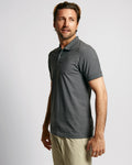 Model wearing Neat Sweat Proof Short Sleeve Polo PDP Grey