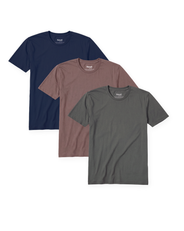 The Navy and Clay Pack: three Neat crew neck shirts fanned on a transparent background, Deja Blue, Dusty Clay and Stone Grey