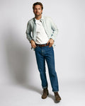 Front view of the Sweat Defender V-Neck Undershirt 4-Pack showing its white V-neck fit on a male model